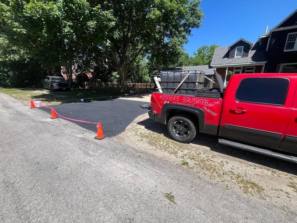 Commercial parking lot sealed by Hooners Sealcoating — wide-format commercial scale